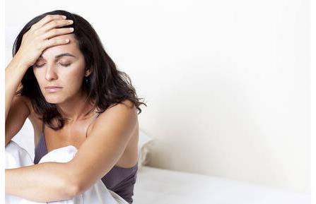 Woman not feeling well in bed