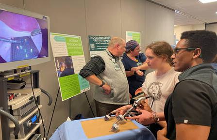 Kai Britton of Hartland, VT, participates in a laparoscopic procedure demonstration using a Lite Brite® toy at 十大网赌平台推荐卫生’s 2023 Career Expo.